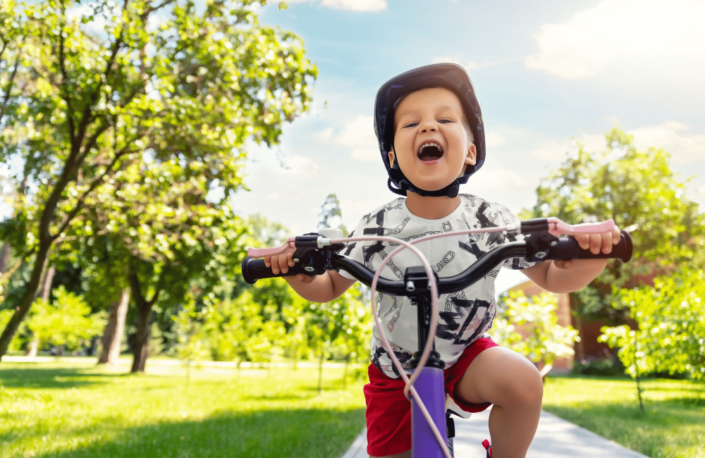 cute little boy riding bike cute little boy riding bike
