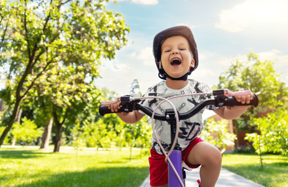 cute little boy riding bike