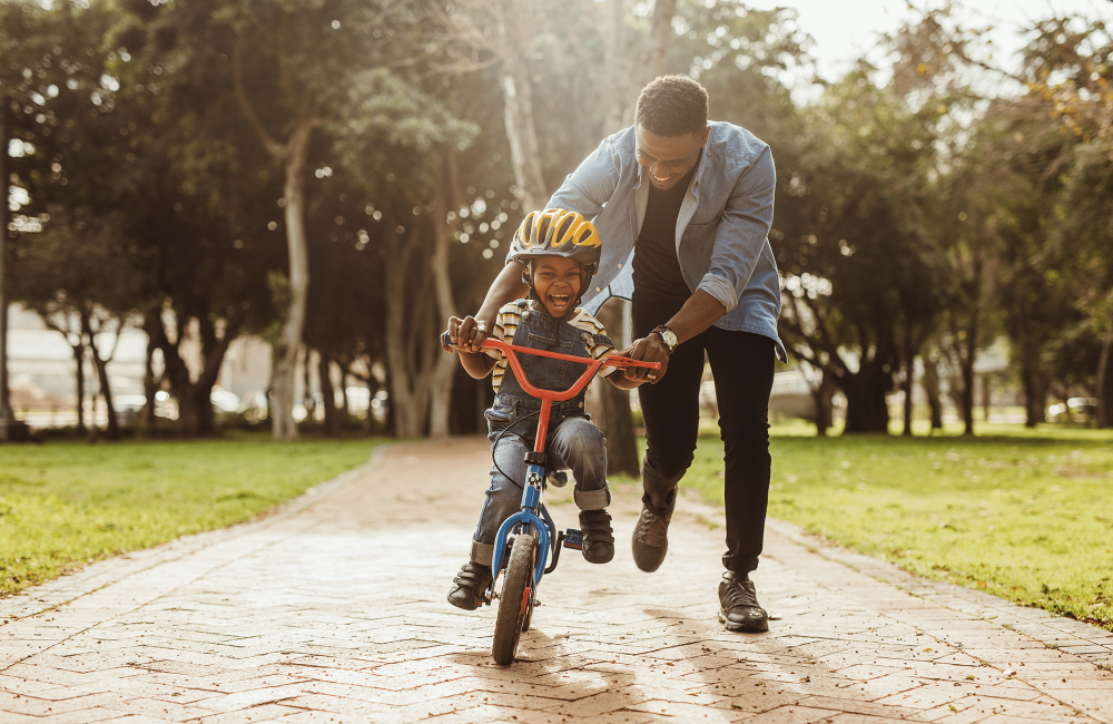 dad and son on bike dad and son on bike