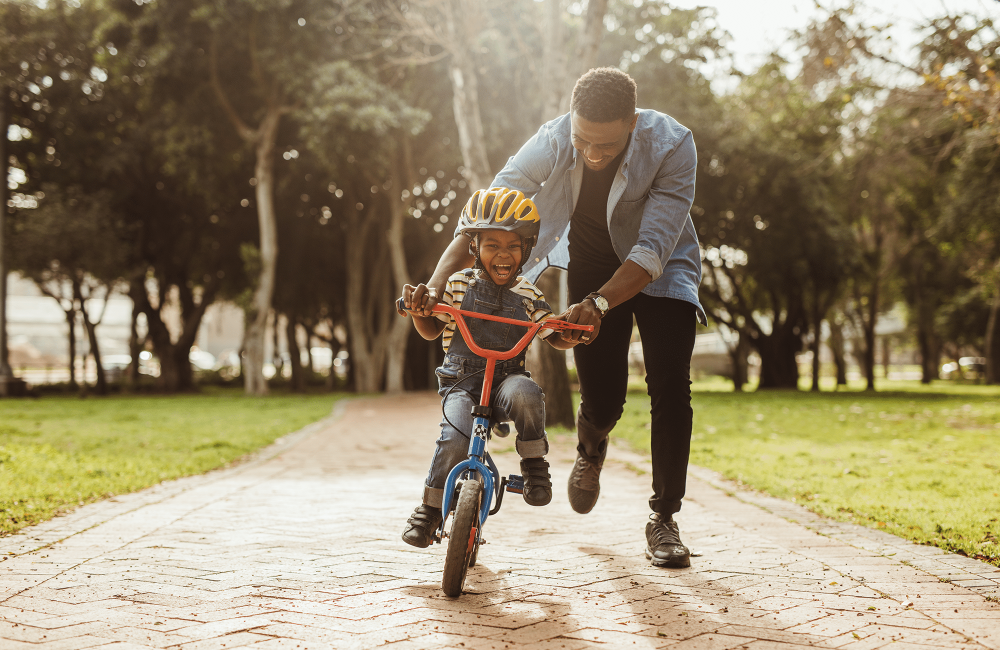 dad and son on bike