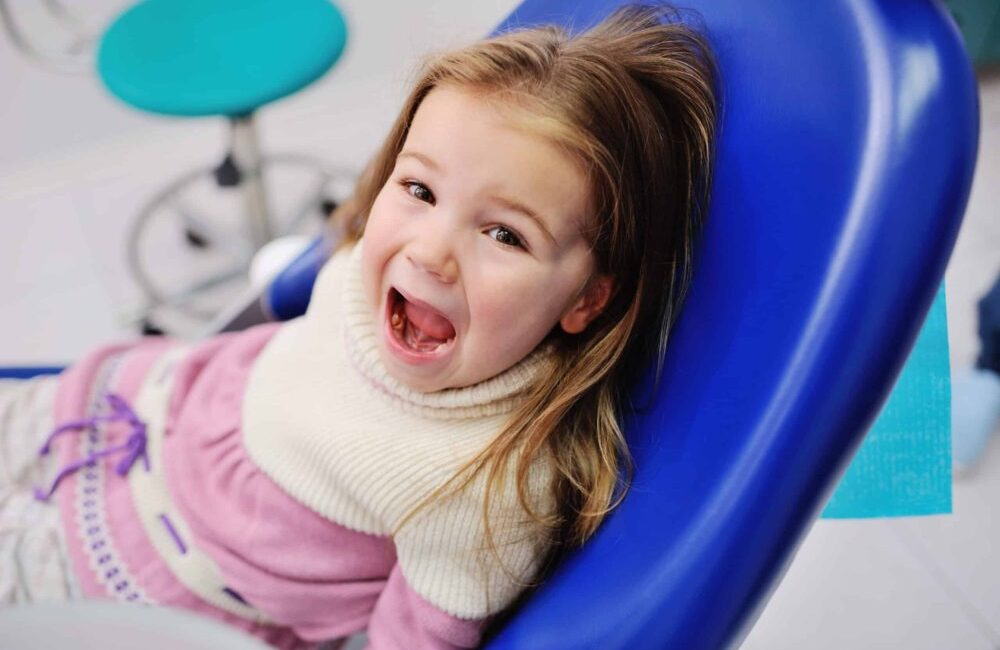 Cute,Baby,Girl,Sitting,In,A,Dental,Chair,And,Looking